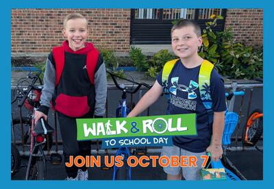Walk & Roll to School Day - Join Us October 7 written with image of two students standing by bike rack outside with blue border