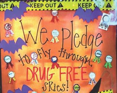 Classroom door decorations made by students for "Red Ribbon Week"