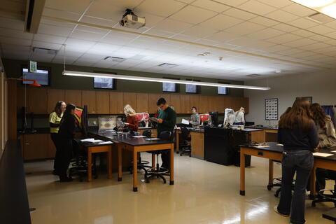 KHS Veterinary Science Team standing around tables 