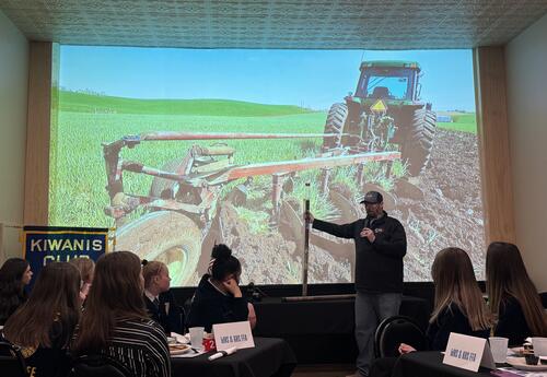 FFA presenter showing slide of tractor