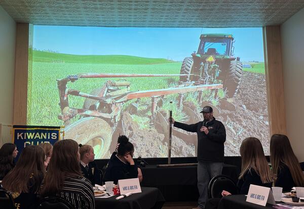 FFA presenter showing slide of tractor