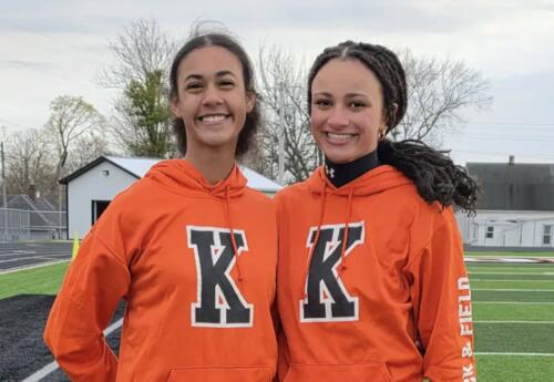 2 students pose at Kewanee high school track