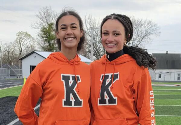 2 students pose at Kewanee high school track
