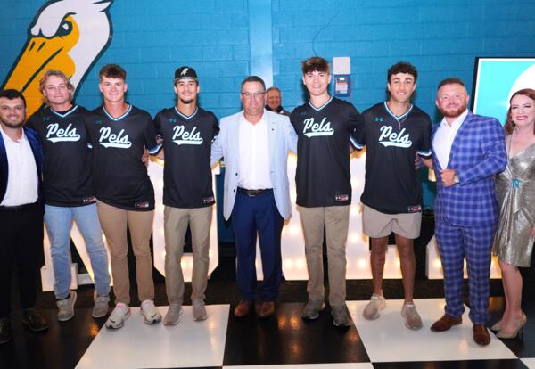 Nunez Baseball players and coaches at an event in the Physical Activity Center