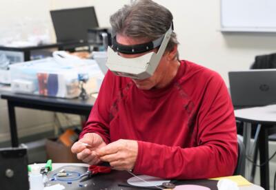 A Fiber Optics student in class at Nunez Community College.
