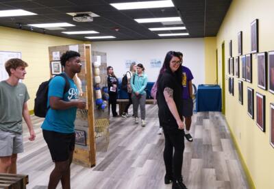 A Nunez instructor and students explore the Los Isleños Historical Archive in the Nunez Library.