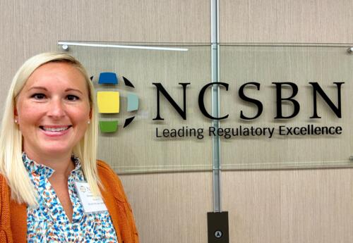 Nunez Nursing Director Brittney Zaffuto poses in front of the NCSB sign.