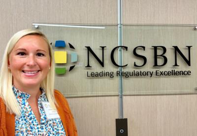 Nunez Nursing Director Brittney Zaffuto poses in front of the NCSB sign.