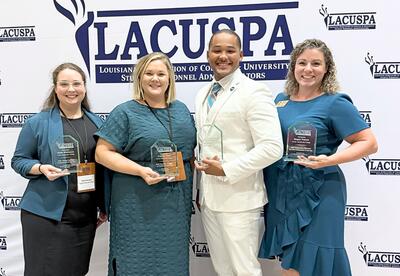 Nunez staff pose with their LACUSPA awards.