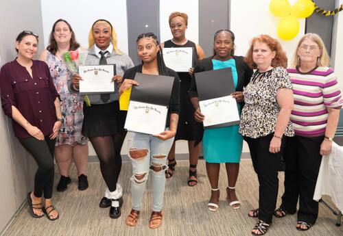 Students pose with program sponsors at Nunez's 2025 Gamma Beta Phi induction ceremony.