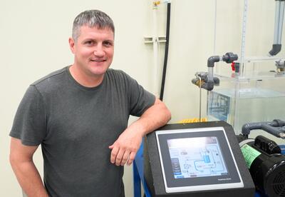 Nunez student Billy Stockstill stands by the trainer he used for his SkillsUSA demonstration.