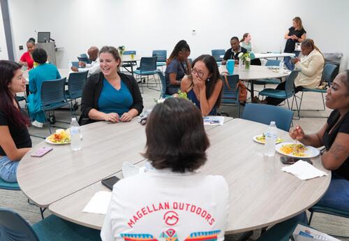 Students laugh while talking at the Dean's List Luncheon.