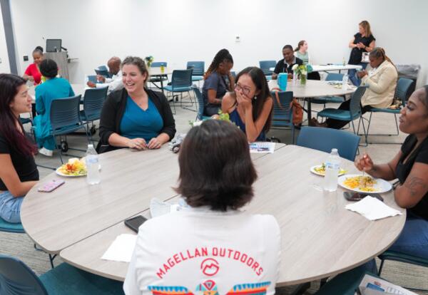 Students laugh while talking at the Dean's List Luncheon.