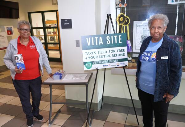 VITA tax preparers Gail Jenkins and Gwen Ricks are shown in front of the Nunez Library