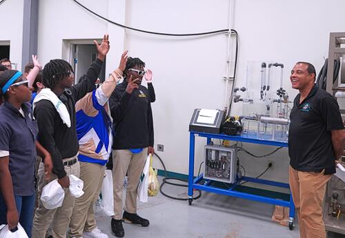 A Nunez instructor speaks to visiting high school students in the Process Technology lab.