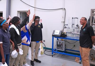 A Nunez instructor speaks to visiting high school students in the Process Technology lab.