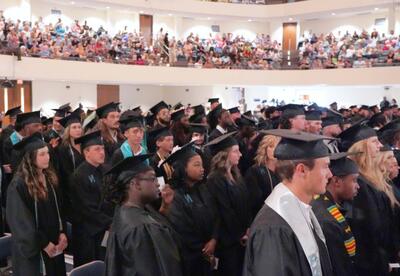 Graduates attend a Nunez Community College Commencement Ceremony