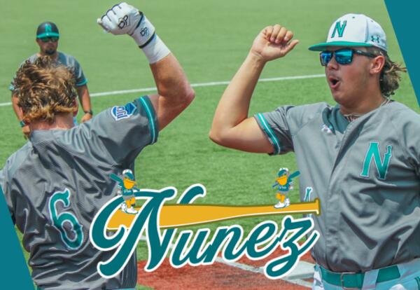 Two Nunez Baseball players celebrate during a game.
