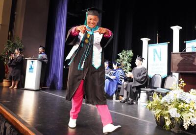 Nunez 2025-2026 SGA President Troy Sino Jr. walks across the stage during the 2026 Commencement Ceremony.