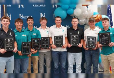 Winners of Nunez Baseball's top awards for the 2026 season pose with their awards.
