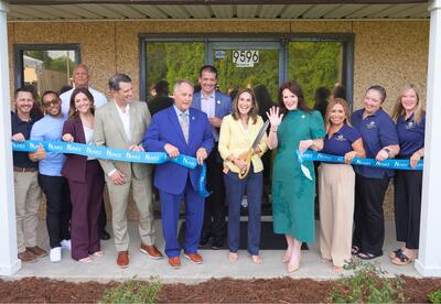 Dr. Tinney cuts the ribbon to open Nunez's Plaquemines site.