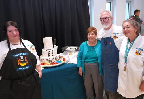 Chef Ruth Varisco poses near a cake made for her retirement party along with ���Ķ���vlog Culinary Instructors Chef Doyle DeForest and Chef Ronda DeForest