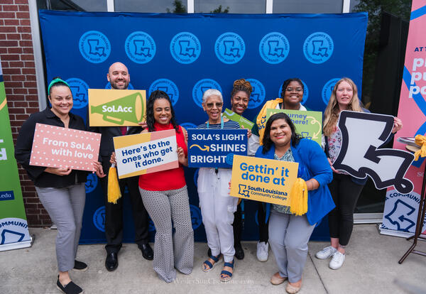 employees holding signs