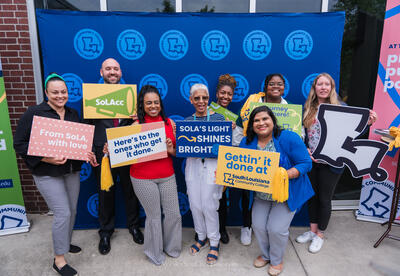 employees holding signs