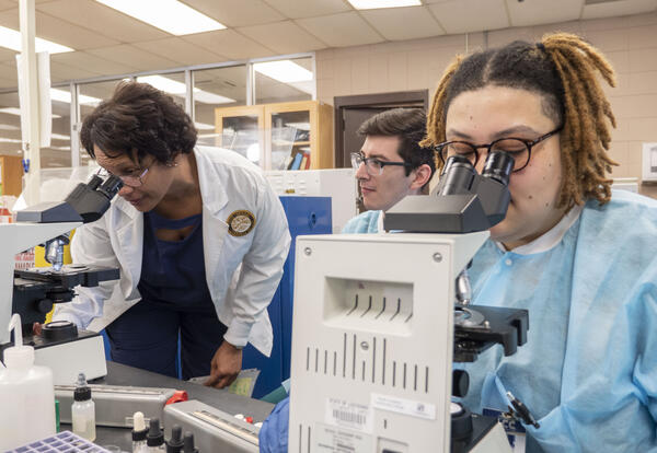 instructor and students in medical lab