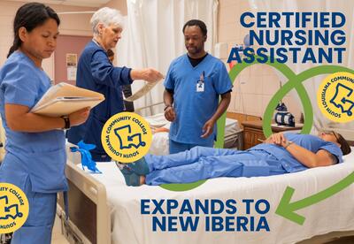 Nursing instructor stands over a student at SoLAcc