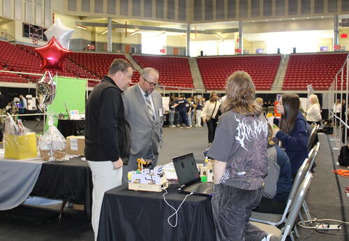 Teachers viewing a student project during the showcase