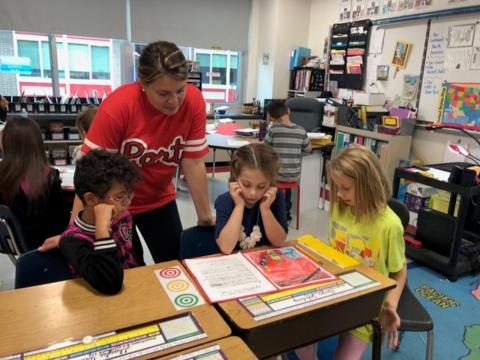 Teacher Working with Students on Personal Narratives