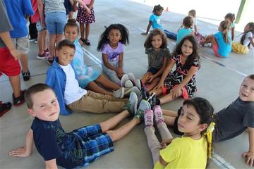 Boys and girls sitting in a circle