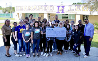 Group shot with large check
