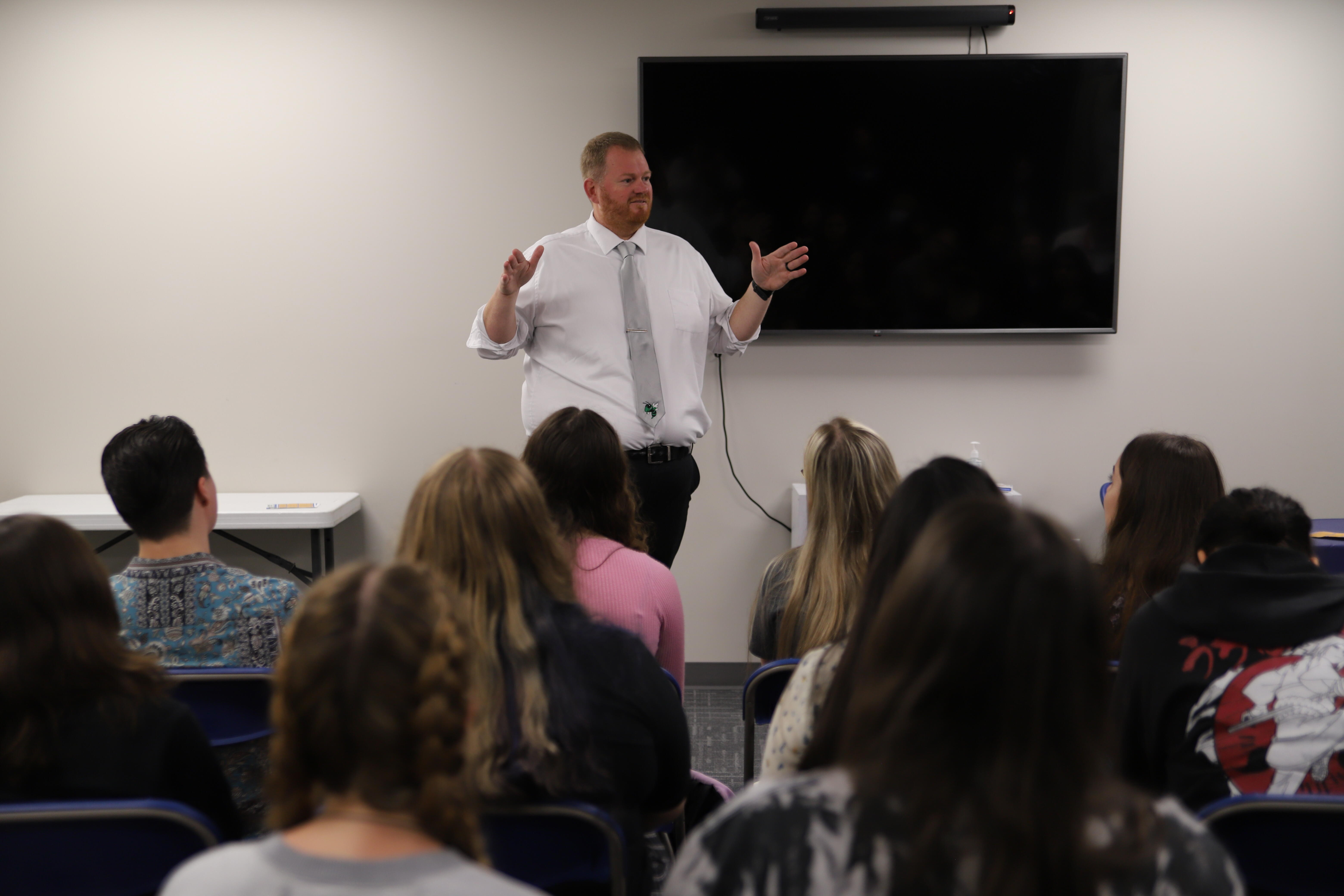 Staff addressing students at the Hernando Grown event