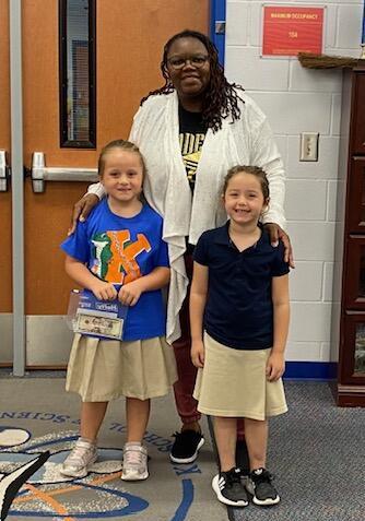 Librarian with 2 students