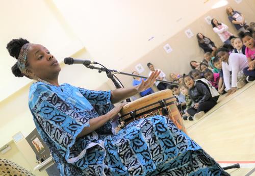 Ayanna Gregory plays the drum and sings for Sheridan Prep. students.