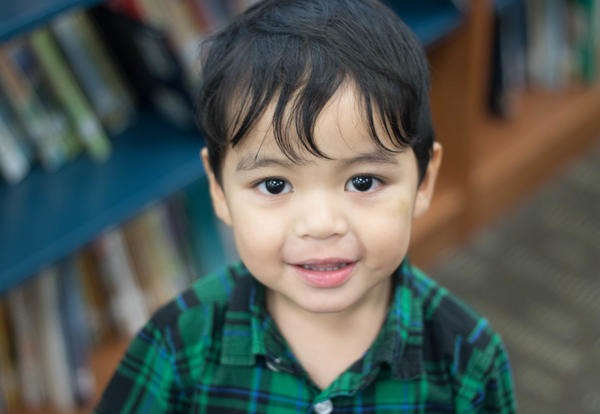 Toddler boy smiles