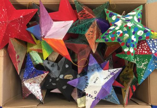 A box of stars created by students in art class at ǷԴ School of Humanities.