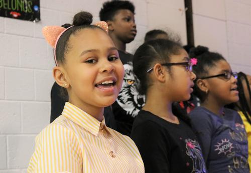 Fourth-graders sing during Arbor Hill Elementary's black history month assembly.