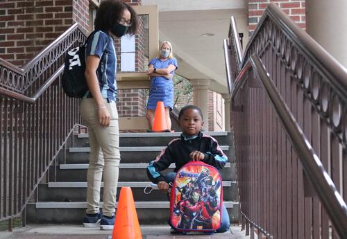 A student prepares to enter ASH for the day.