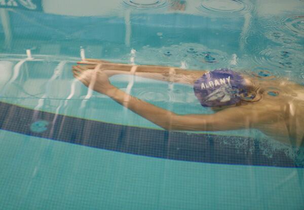 An 91 High School swimmer competes.