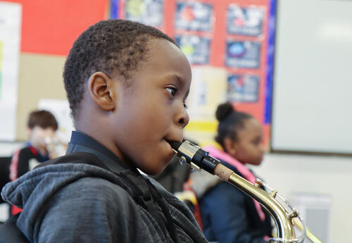 Student plays saxophone