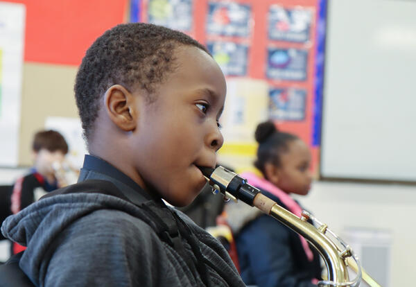 Student plays saxophone