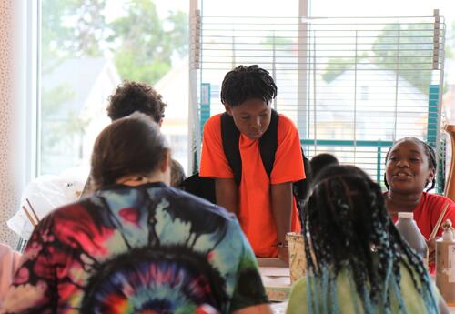 Students paint during a summer art program