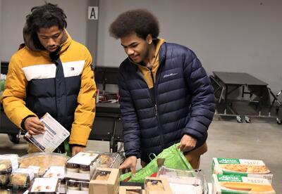 Students packing food bags