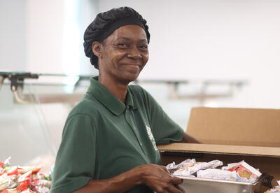 Lunch aide smiling at work