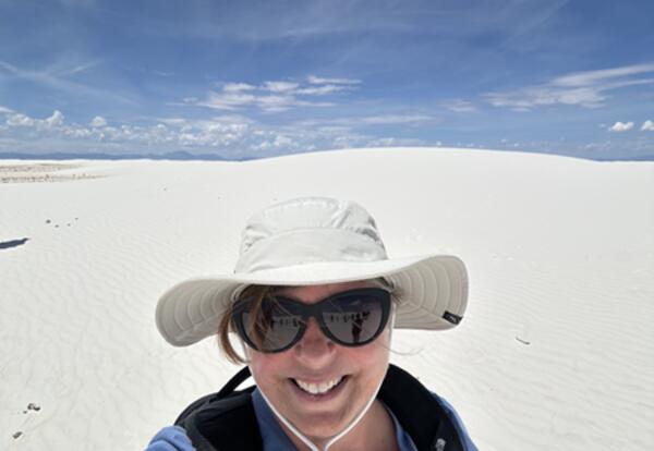A photo of Cheryl Backman at White Sands National Park.