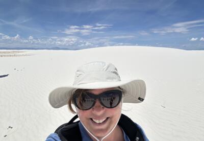 A photo of Cheryl Backman at White Sands National Park.