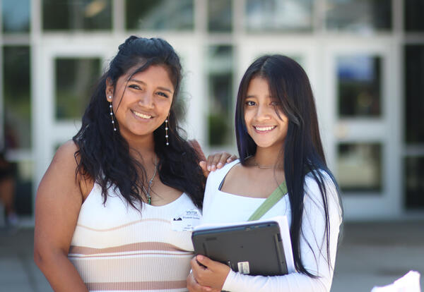 Photo of student & adult at welcome back day